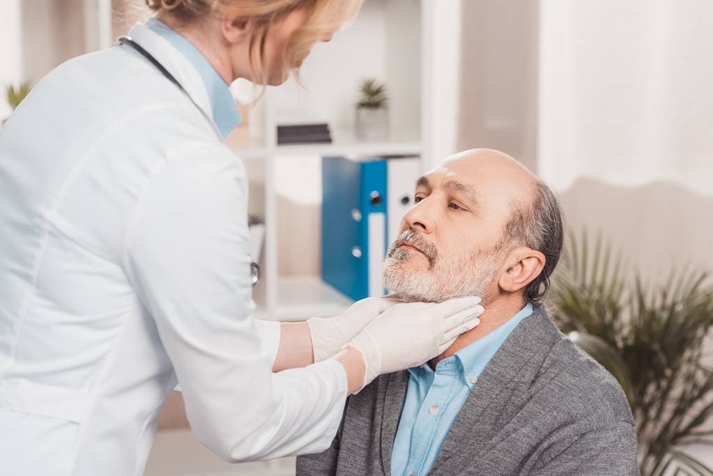 A clinician providing an in-office examination